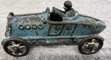 Cast Iron race car with man, has had some repair, approx. 5 ¼”