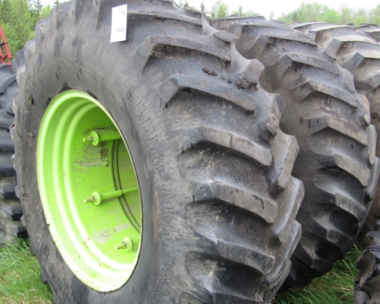 1946. Pair of 23.1 X 34 Inch Tires on Steiger Rims with Attached Band Dual