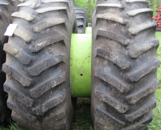 1947. Pair of 23.1 X 34 Inch Tires on Steiger Rims with Attached Band Dual
