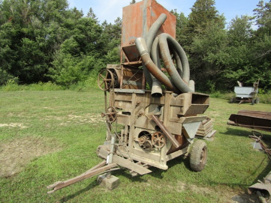 21. EARLY #47 CLIPPER FANNING MILL ON SHOP BUILT TRANSPORT, EXTRA SCREENS, OWNER’S MANUAL