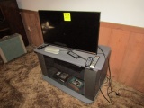 1028. FLAT SCREEN TV AND ENTERTAINMENT CENTER
