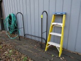 1048. FIRE WOOD HOLDER, 4 FT. FIBERGLASS STEP LADDER, GARDEN HOSE
