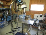 934. (2) STAINLESS STEEL EXAMINATION TABLES, (2) EXAMINATION LIGHTS, MISC.