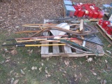 991. PALLET OF SHOVELS, RAKES, SCYTHES, GARDEN BENCH BRACKETS, & MISC.