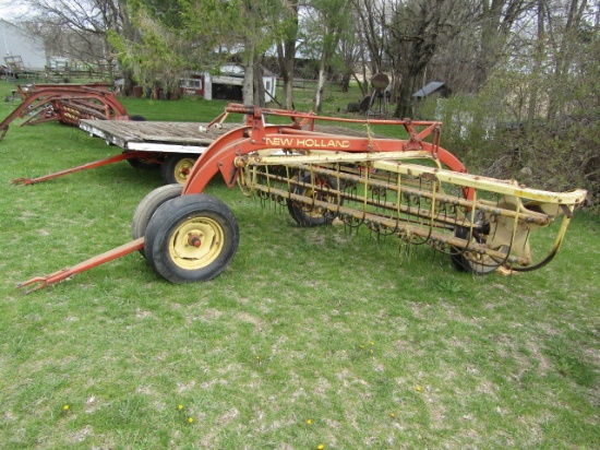 147. NEW HOLLAND 256 9 FT. PARALLEL BAR RAKE WITH HITCH WHEEL