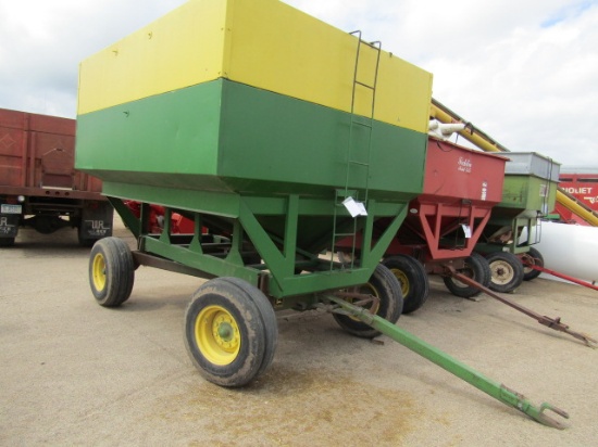 874. 283-567. 300 BUSHEL +/- GRAVITY BOX ON JD 4 WHEEL WAGON, TAX / SIGN ST