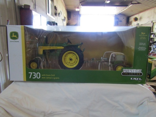 900. 1/16 ERTL JD 730 W/ GRAIN DRILL, PRESTIGE COLLECTION, NIB