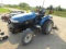 304. NEW HOLLAND MODEL TC 25D MFWD DIESEL COMPACT TRACTOR, 3 POINT, SIDE BA