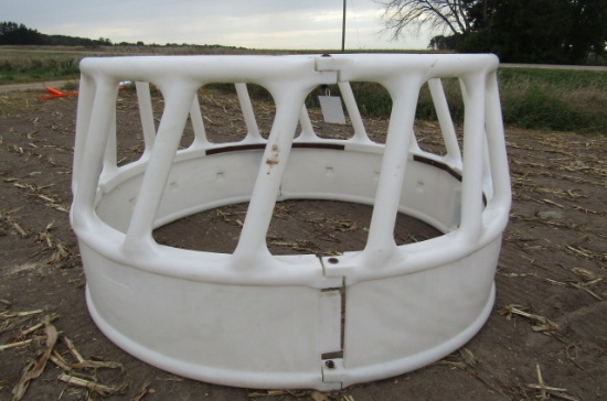 1209. 8 FT. POLY ROUND BALE FEEDER WITH HAY SAVER
