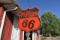 953. PHILLIPS 66 SIGN WITH STEEL POST, DOUBLE SIDED, PORCELAIN, 29” WIDE X