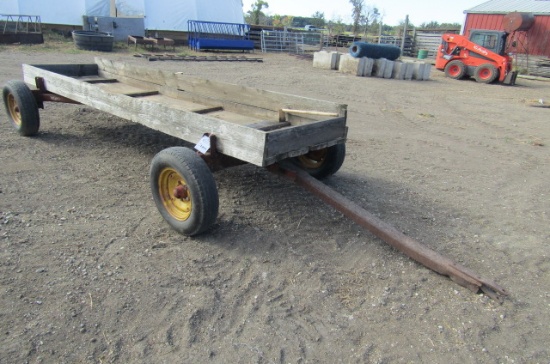 1311. MN SUPER 6 FOUR WHEEL WAGON WITH  36 INCH WIDE X 14 FT. WOODEN FEED B