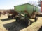 1305. HUSKY MODEL 250 GRAVITY BOX ON HARMS FOUR WHEEL WAGON
