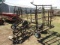 1311. 4 SECTION TINE TOOTH HARROW ON HARMS HYDRAULIC CART