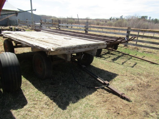 1302. 7.5 FT. X 14 FT. WOODEN FLAT BED ROCK TRAILER WITH HYD. HOIST ON HARM