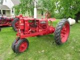 1881. 1935 FARMALL F-12 ON RUBBER, HAND CRANK, BELT PULLEY, NEW FRONT TIRES