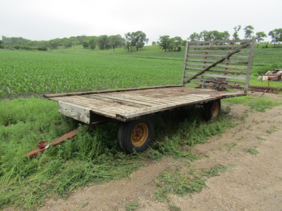 1641. 102” WIDE X 19 FT. WOODEN FLAT RACK ON KEWANEE FOUR WHEEL WAGON, EXT.
