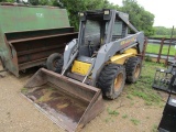 1676. 2000 NEW HOLLAND MODEL LS 180 DIESEL SKID STEER LOADER, HAND AND FOOT