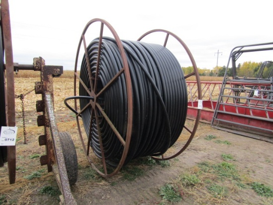 713. APPROX.  3800 FT.  FT. OF 1.5” PLASTIC WATER LINE ON REEL, NO CART