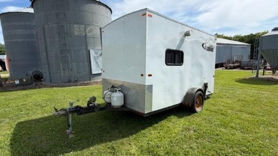 "THE LODGE" 6.5' X 12' 6 HOLE FISH HOUSE, CRANK DOWN FRAME, LP WALL HEATER, STORAGE CABINETS