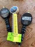 3 beer handle/taps 1 Saugatuck brewing 1 fetch brewing 1 unruly brewing co.