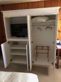 Large white  cabinet with tv