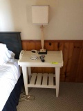 White bedside table with lamp