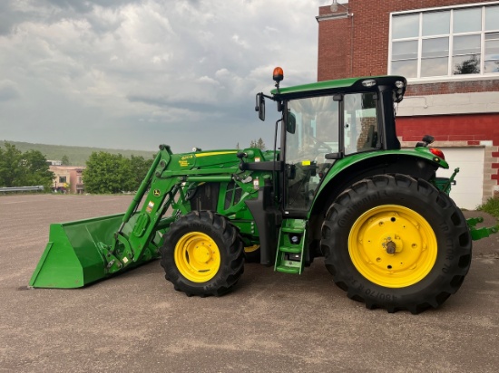 Loc: Bus. 2020 John Deere 6120M tractor with a 2018 John Deere 620R Front End Loader, 912 hours. Ple
