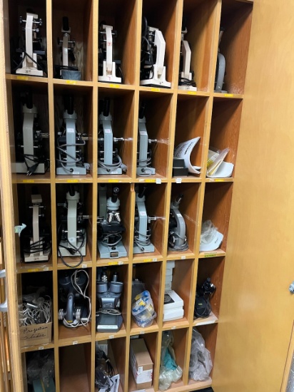 Loc: 3. Cabinet of assorted older model microscopes (30) and accessories. This lot is located at: 60