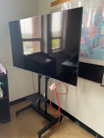 Loc: 3. Samsung 70" flat screen TV on rolling cart. This lot is located at: 601 Franklin St, Hancock