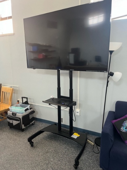 Loc. 4, N30. Onn 70" Flat Screen TV w/ Roku Smart TV on Rolling Cart. This lot is located at: 601 Fr