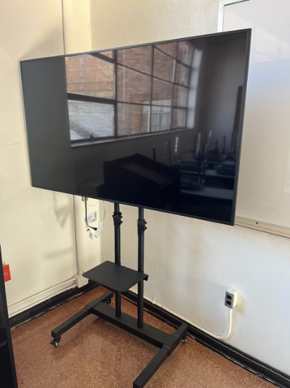 Loc: 4, N28. Samsung 65" Flat Screen TV on rolling cart. This lot is located at: 601 Franklin St, Ha