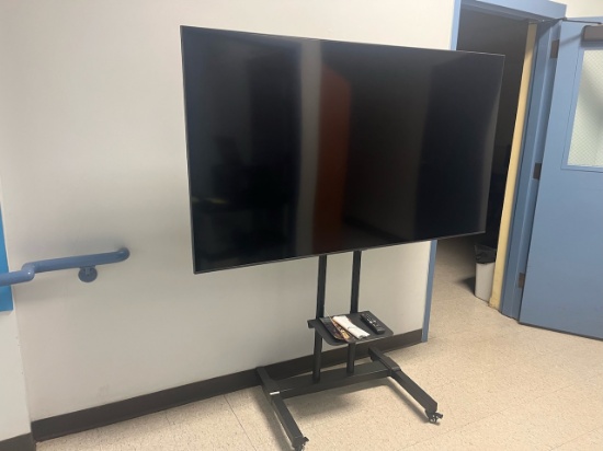 Loc: 4, bottom flr. Samsung 70" flat screen TV on rolling cart. This lot is located at: 601 Franklin