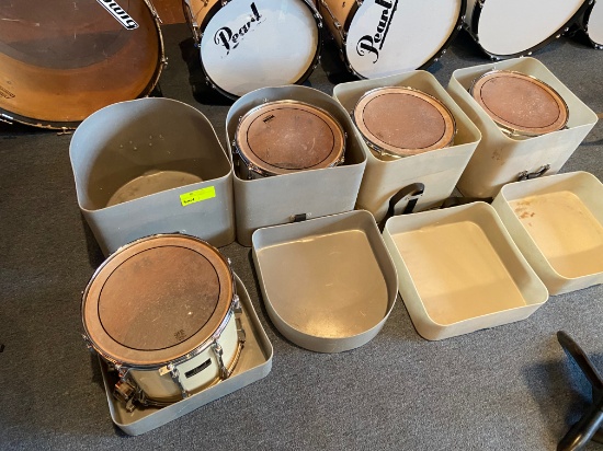 Loc: 11, Stage. Set of 4 Pearl Snare Drums with Carrying Cases.. This lot is located at: 417 Quincy