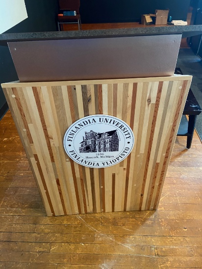 Loc: 11, Stage. Finlandia University Podium (31" X 24" X46") and Coffee Table. This lot is located a