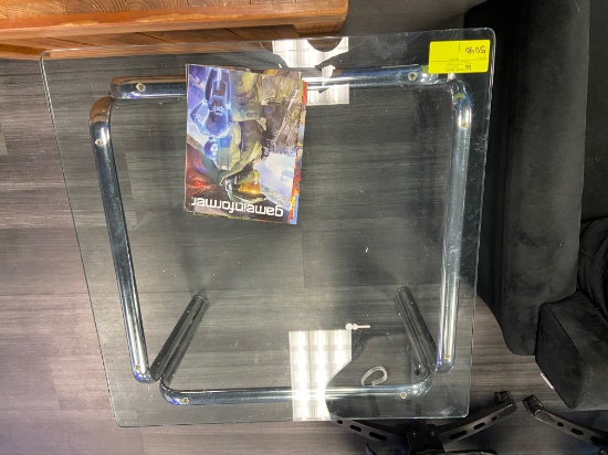 Loc: 11, eSports. Misc. Furniture - 23"X32" Glass Table, 81" X 34" X28" Black Couch, and Green Couch