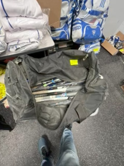 Loc: 2. Duffle Bag with 12 bats - various sizes (bag has rips). This lot is located at: 535 Summit S