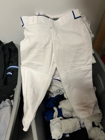 Loc: 2, 105. 20+ White Softball pants with assorted socks and stirrup socks. This lot is located at: