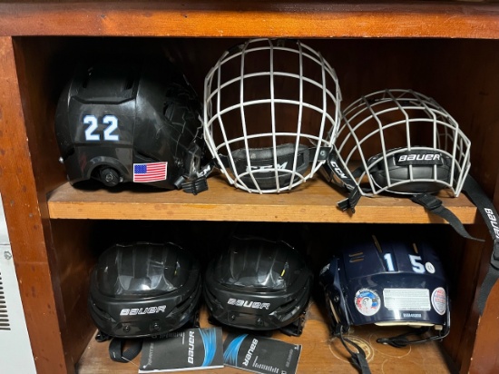 Loc: 2, Court. Lot of new and used hockey helmets and shields, 4 helmets and 2 masks. This lot is lo