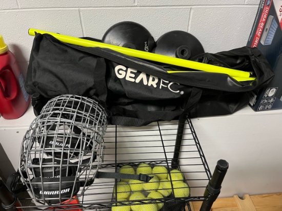 Loc: 2, Court. Lot of misc. hockey, 4 Hockey face masks, cones, 2 alpha gear systems. This lot is lo