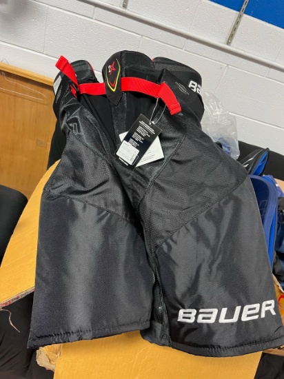 Loc: 2, Court. 5 pairs of assorted new and used Bauer and Vapor brand hockey pant pads. This lot is