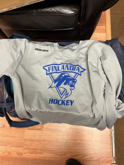 Loc: 2, Court. Assorted used Finlandia University practice hockey jerseys, 30+. This lot is located