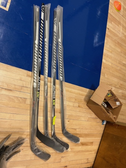Loc: 2, Court. New Warrior Alpha LXT W03-85-FLEX-SR Hockey Stick. This lot is located at: 535 Summit