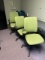 Green office chairs on wheels