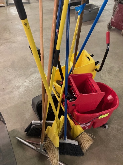Assorted brooms and mop buckets