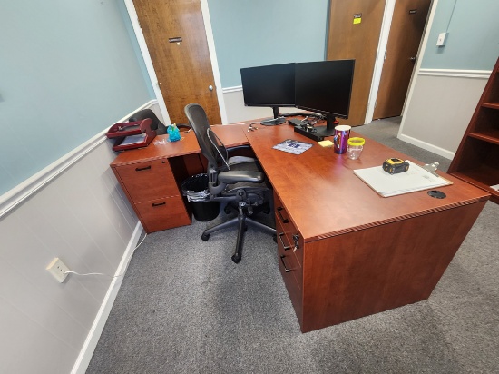Executive office furniture with desk, chairs and dual Lenovo monitors and keyboard