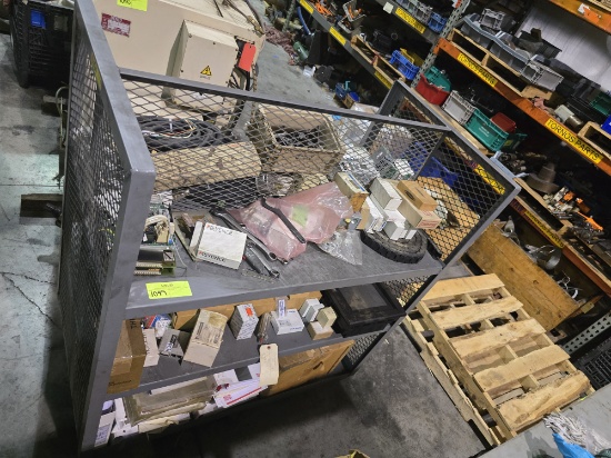 Rolling metal shelf with contents