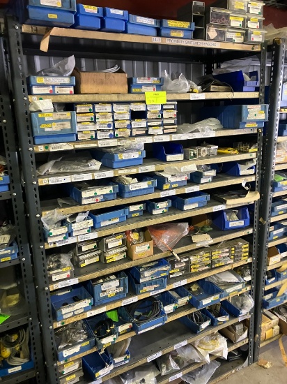 Shelving unit appx. 48"w x 75"h w/ misc. contents - contains sensors, switches, etc.