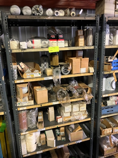 Shelving unit appx. 48"w x 75"h w/ misc. contents - contains filters, etc.