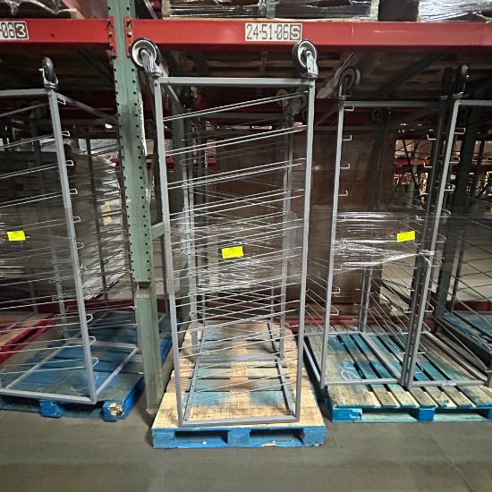 Slanted metal shelf on casters
