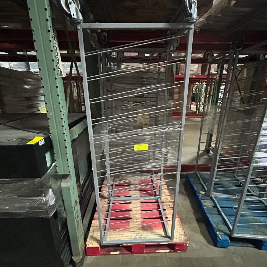 Slanted metal shelf on casters
